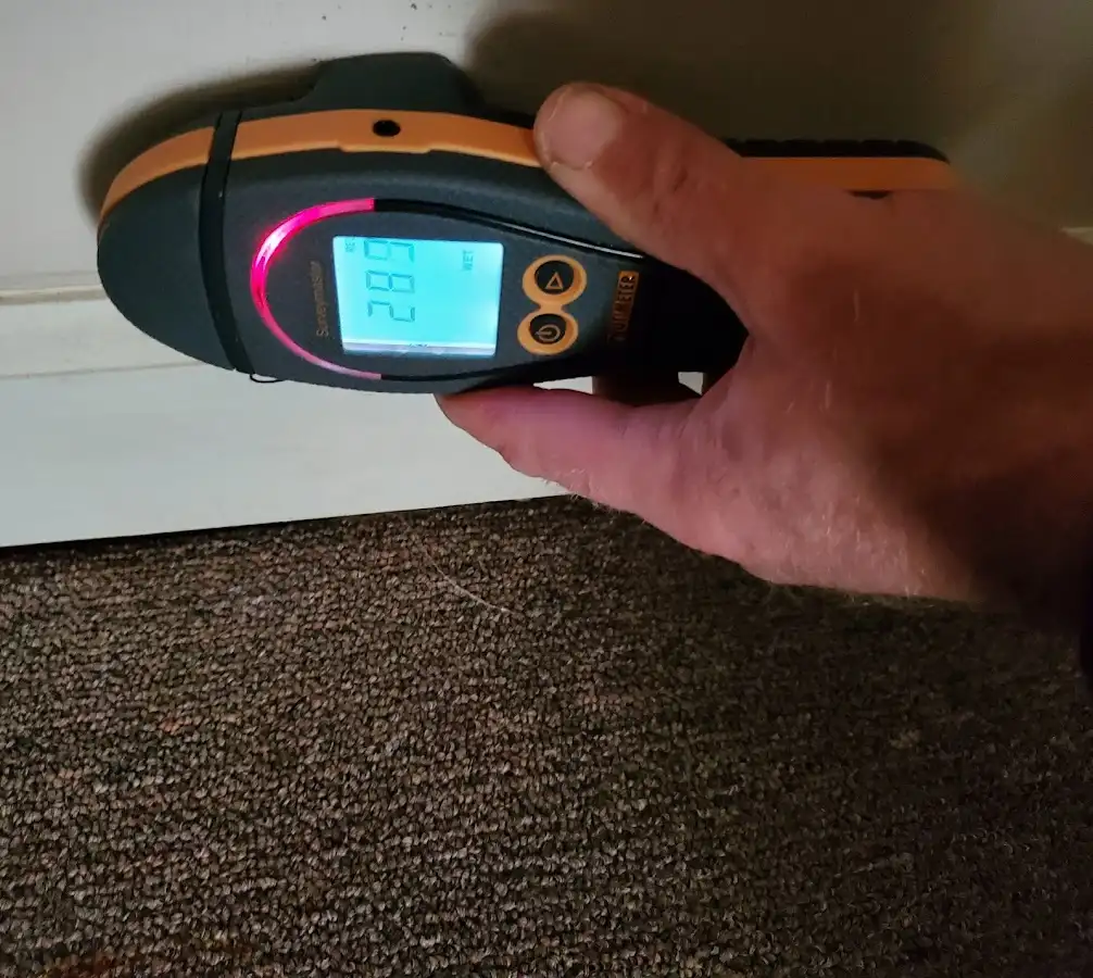 Moisture detection at baseboard during Storm Damage Restoration in Nevada